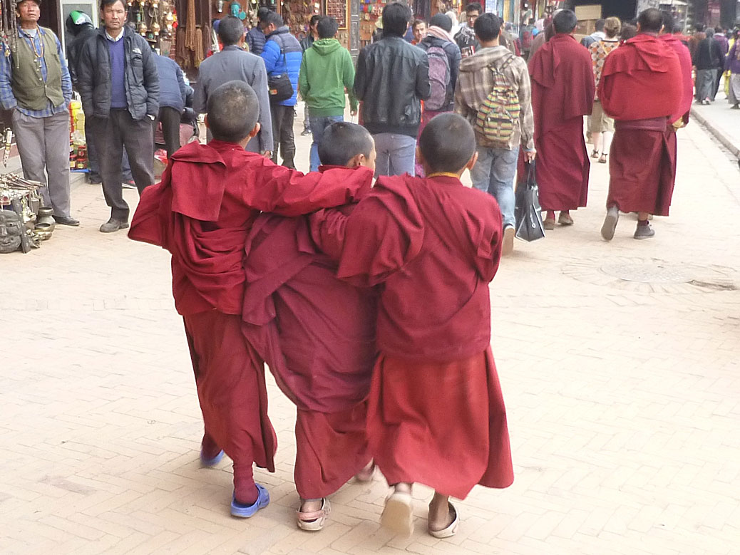 Young Buddhist monks-in-training having a little fun at Boudhanath