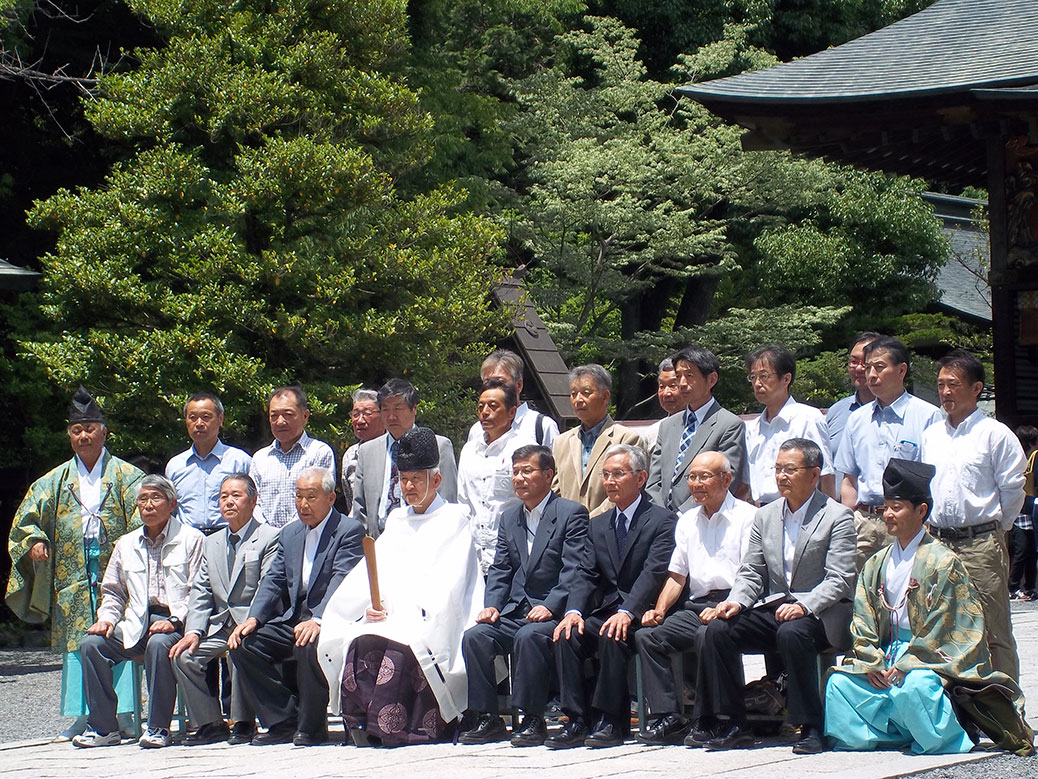 A ceremony took place in the shrine while we were there and they gathered for a photo after. The Shinto priest (kannushi) is seated in the middle. It appeared to be a business group, perhaps receiving a blessing for an upcoming project, a common occurrence in Japan.