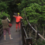 This couple brought their cat hiking with them and posed for several pictures on the Hashidate Suspension Bridge.