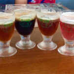 The six-glass sampler at Izu Kogen Brewery included a yamamomo champagne beer, an orange beer and a stout made in honor of the 1998 summit between Russian president Boris Yeltsen and Japan's prime minister Ryutaro Hashimoto