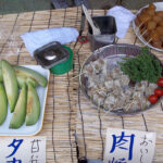 Melon, stuffed meat pockets on a stick and marinated gourd on a stick