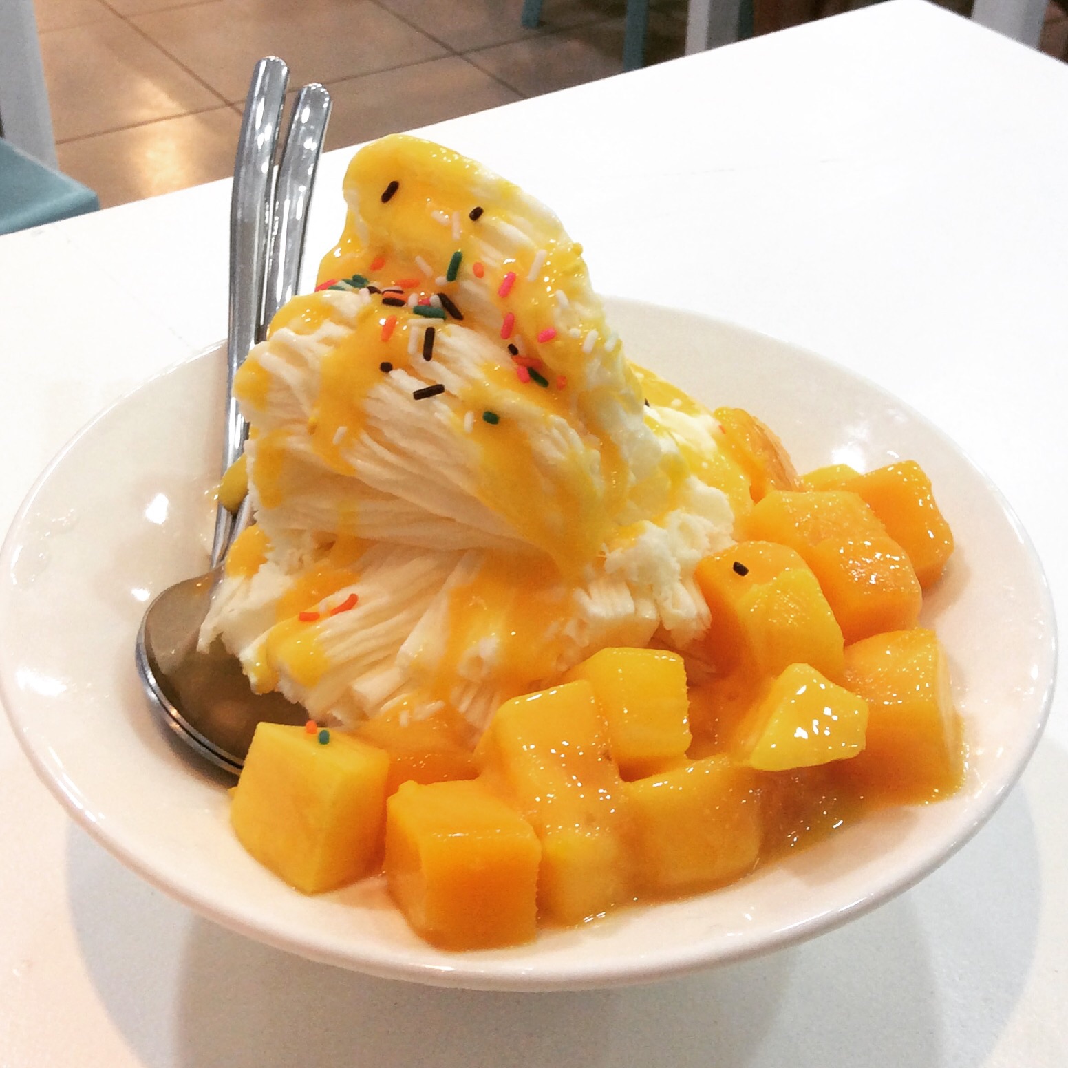 Baobing, the quintessential Taiwanese dessert, is made with shaved ice and a variety of toppings. This mango Baobing at Shilin Night Market had mango syrup, shaved ice with mango flavoring frozen into the ice and chunks of fresh mango fruit.