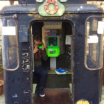 An old cable car has been turned into a public phone booth in Nikko's city center