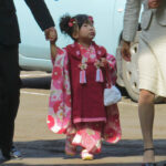 This little girl has likely just turned 3-years-old and is celebrating Shichi-Go-San (Seven-Five-Three). At age 3 and 7 (3 and 5 for boys), girls visit the shrine dressed in traditional kimono to wish for a long and healthy life.