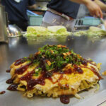 Vegetarian okonomiyaki at Nagata-ya in Hiroshima. Nagata-ya is one of the most popular shops in town and offers several vegetarian-friendly options—a rarity in Japan. The highlight was slivers of fried garlic sprinkled on top.