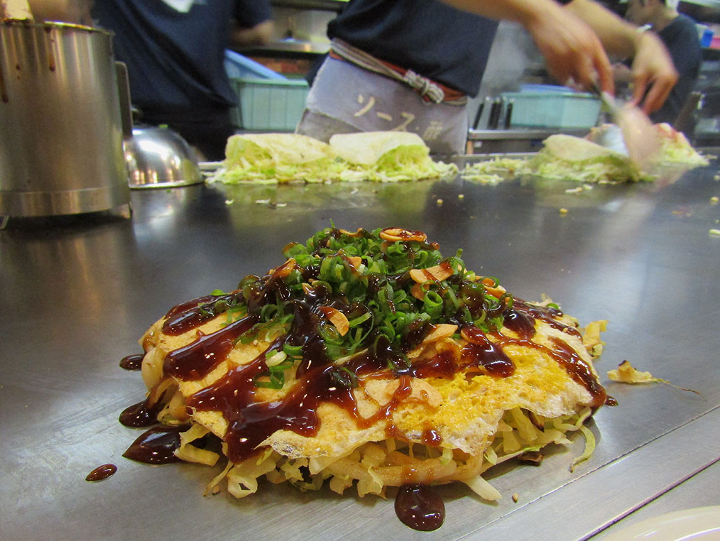 Vegetarian okonomiyaki at Nagata-ya in Hiroshima. Nagata-ya is one of the most popular shops in town and offers several vegetarian-friendly options—a rarity in Japan. The highlight was slivers of fried garlic sprinkled on top.