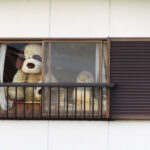 These guys were peering out the window of an apartment. After our fifth brewery, it was a pretty hilarious sight.