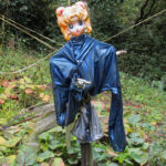 Scarecrows are usually to keep the birds out, but the .38 Special it's holding seems to be directed more at the hikers.