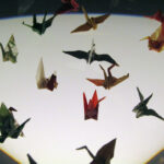 Actual cranes folded by Sadako Sasaki in her hospital room as she battled leukemia. These are about the size of a U.S. quarter.