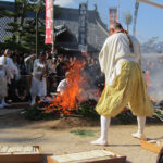 Monks throw thousands of wooden prayer sticks into a blazing fire. In a few minutes, they'll run through the flames.