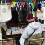 Decorating reusable bags featuring the Kawagoe Farmers Market logo