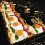 Omusoba, an egg omelette wrapped around yakisoba noodles and topped with an egg, ketchup and mayonaisse. Delicious!