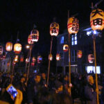 The opening procession features lanterns painted with the names of the Chichibu neighborhoods the carrier represents.