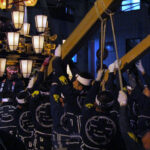 Large wooden pillars are used to raise the float while it's rotated during the nonoji-mawashi performance.