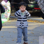 A young hawker at the Yasukuni Flea Market filled the air with his shouts of "Irasshaimase!"—the typical cry of welcome into a Japanese shopping establishment