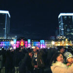 Visitors posing for selfies in front of Tokyo Station's Marunouchi Building illuminations