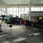 A Japanese "Zero" fighter plane, similar to the ones used in the 1941 attack on Pearl Harbor, is displayed in the lobby of the Yūshūkan military museum