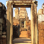 An ornate doorway stands in the ruins of East Mebon temple, offering a perfect frame for visiting photographers.