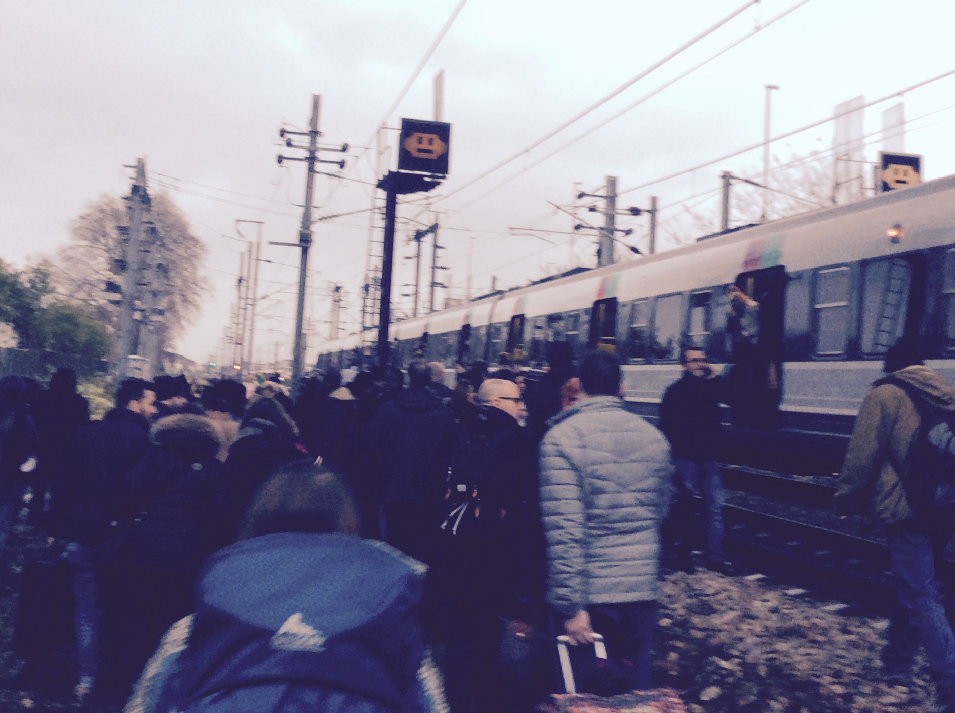 Heading out of the train n the middle of the tracks after a train strike stopped us halfway between Charles de Gaulle Airport and Paris.