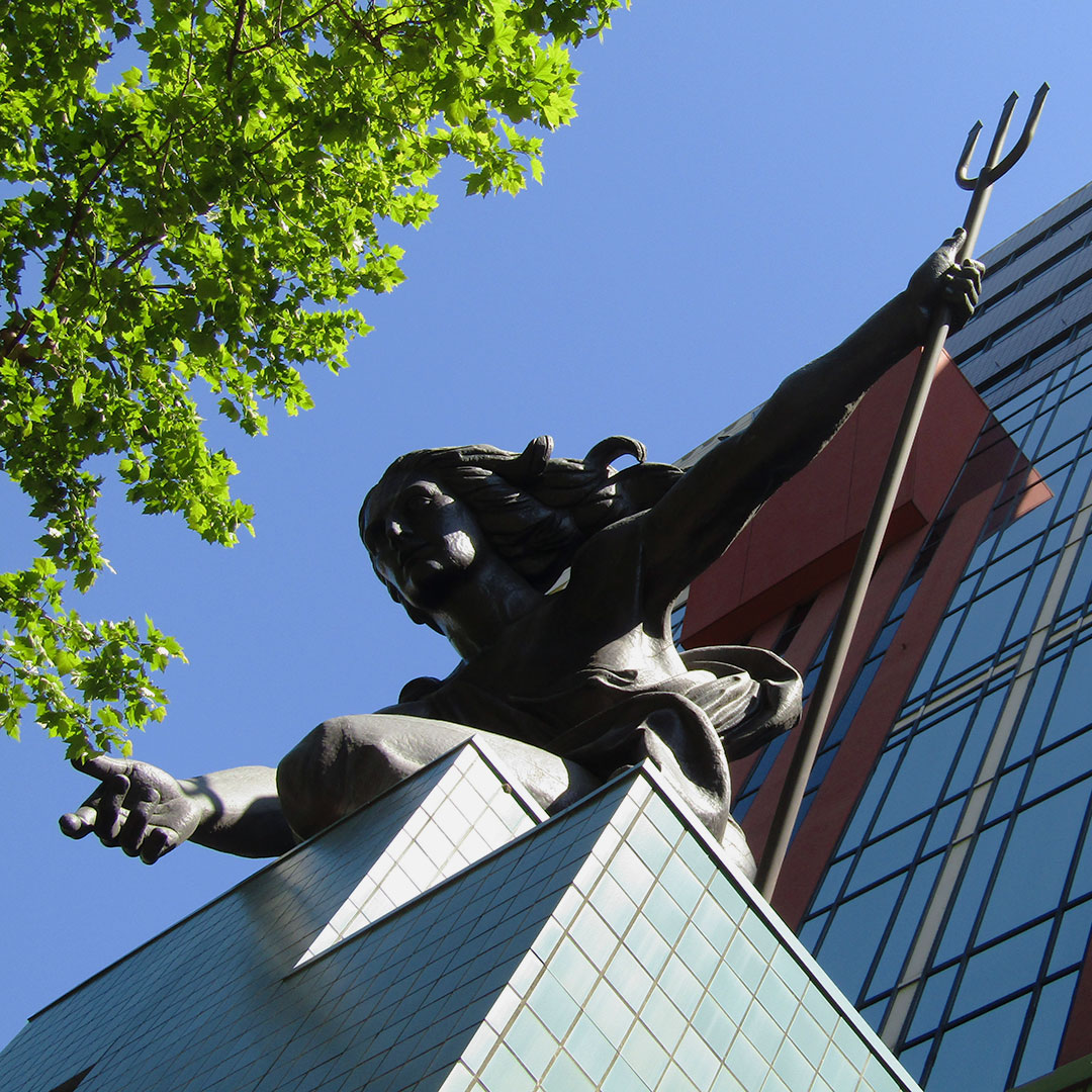 The Portlandia statue looks down over 5th Ave. in Downtown Portland from her perch atop the Portland Building.