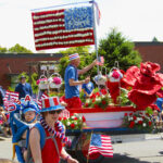 A local florist decked out a float in red, white and blue flowers.