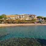 Looking back onto the seaside village from the diving boat.