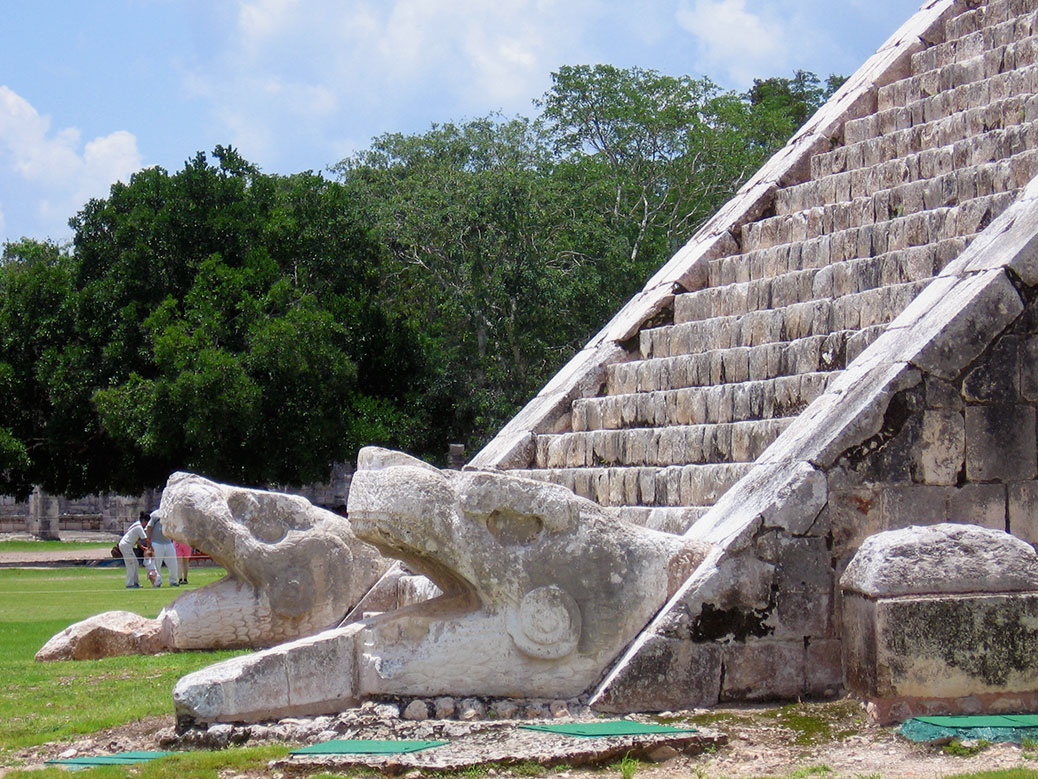 Snake (Kukulkan) heads at the bottom of El Castillo pyramid in Chichen Itza.